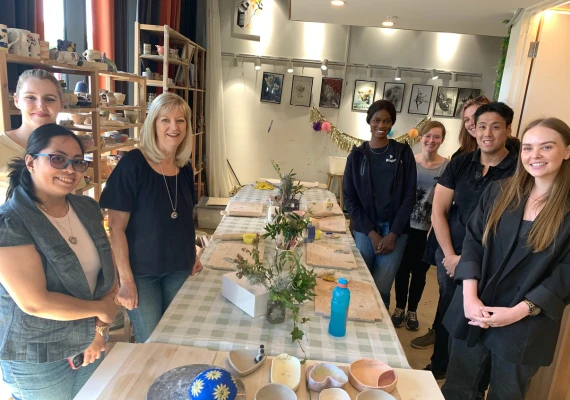 Team members at a pottery session
