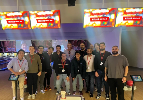 Rapid team posing together at a bowling alley